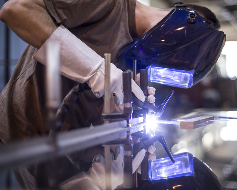 Employee welding titanium