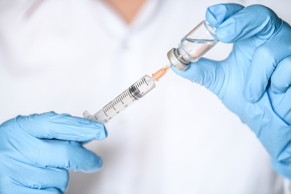 nurse preparing vaccination shot