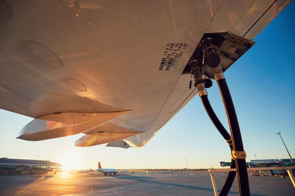 Refueling airplane sunset