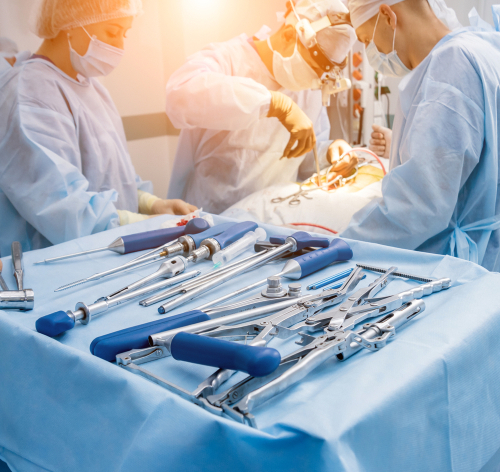 surgical instruments and tools on the blue table. A spine surgery equipment. Medical background