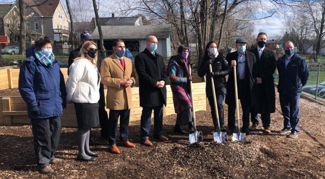 Ulbrich family, YMCA directors, and local, state and national leaders pose for ceremonial breaking ground of new playscape area